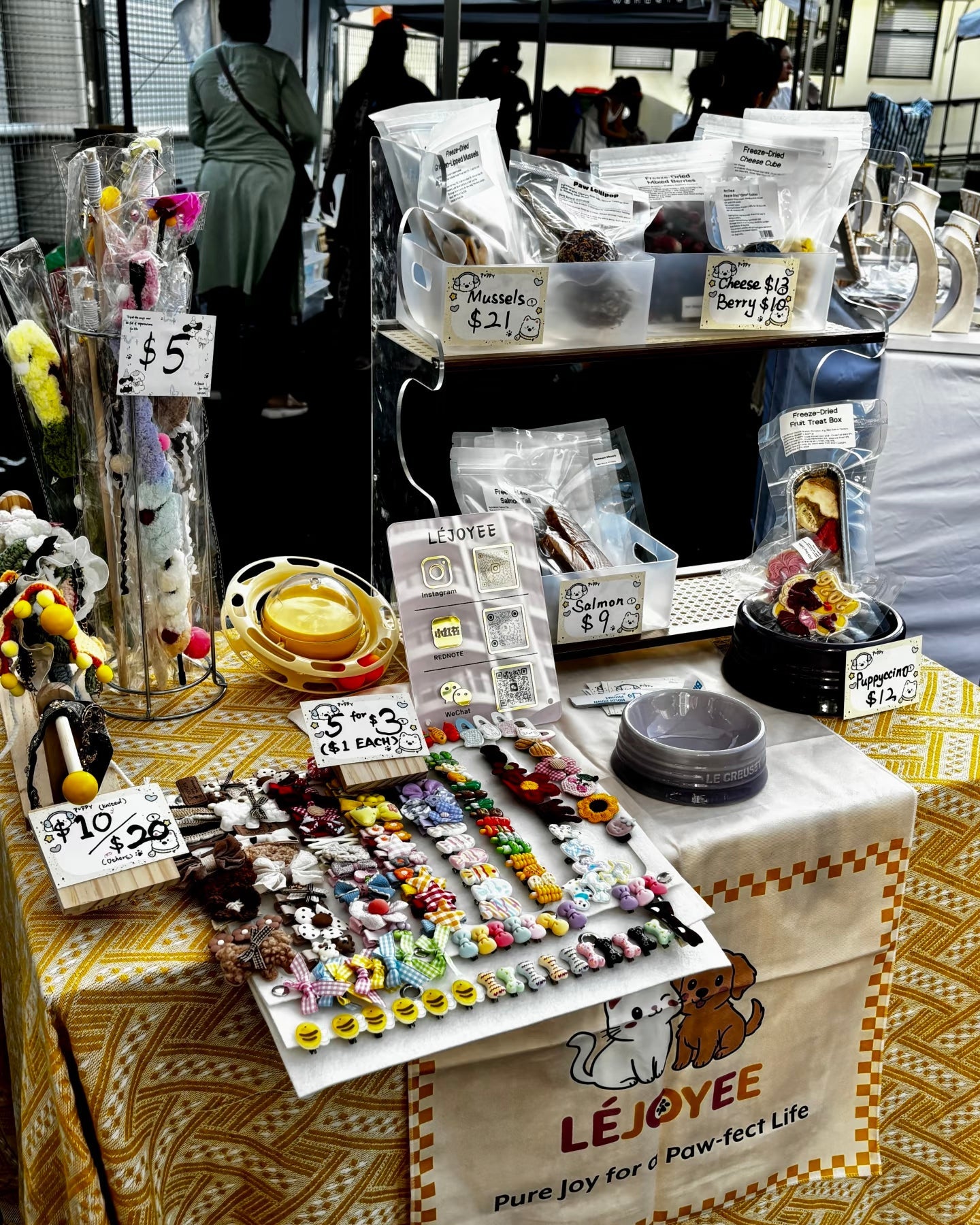 Table with pet accessories and treats.