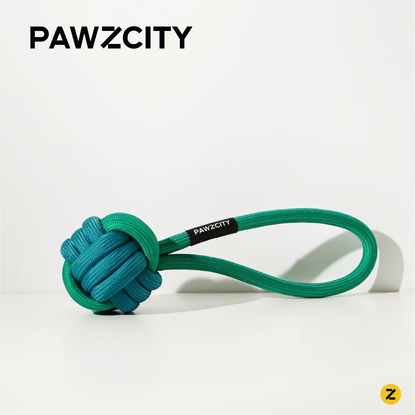 Green dog toy with a loop and &