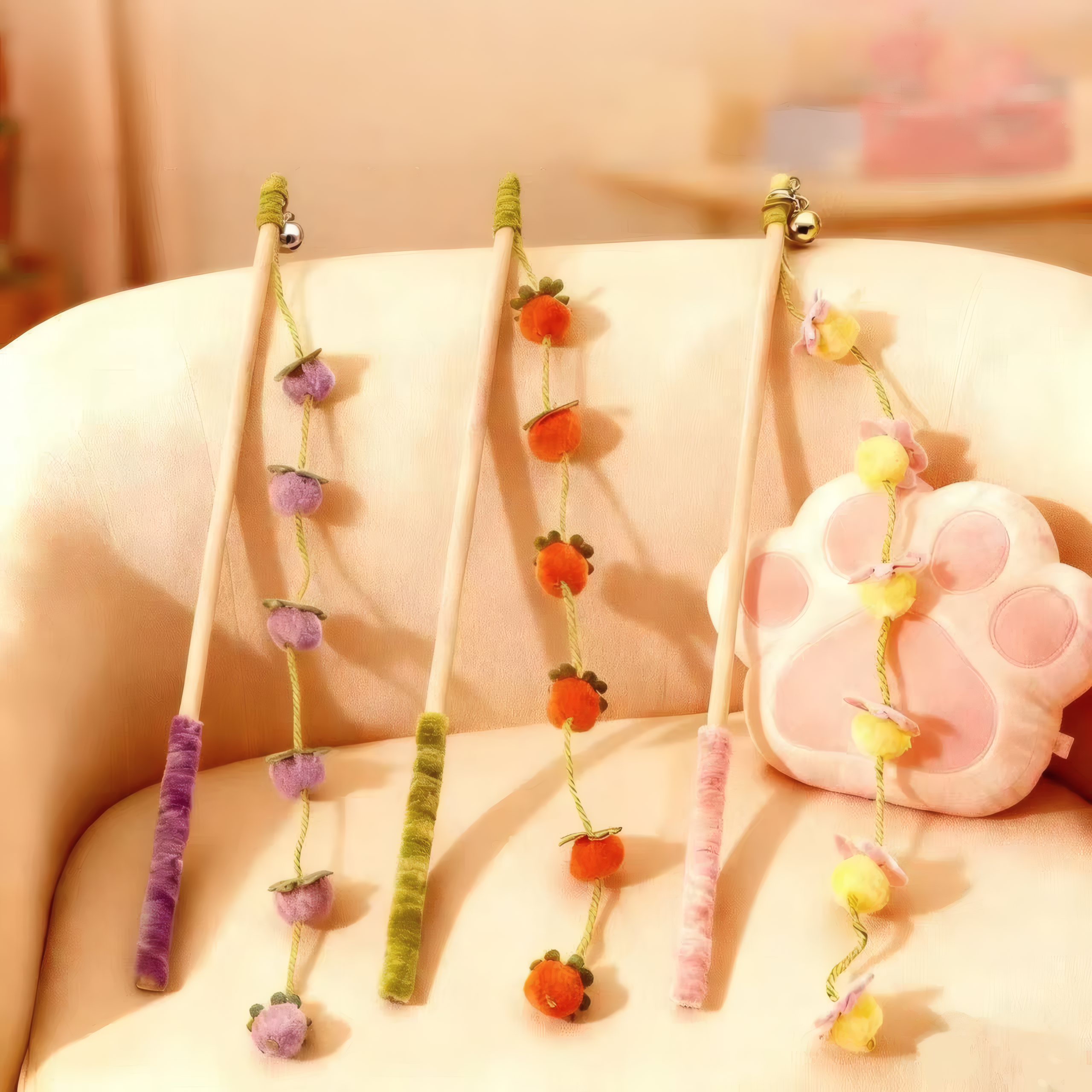 Three variations of the premium wooden cat wand toy: Purple Plum, Orange Tangerine, and Peach Blossom.