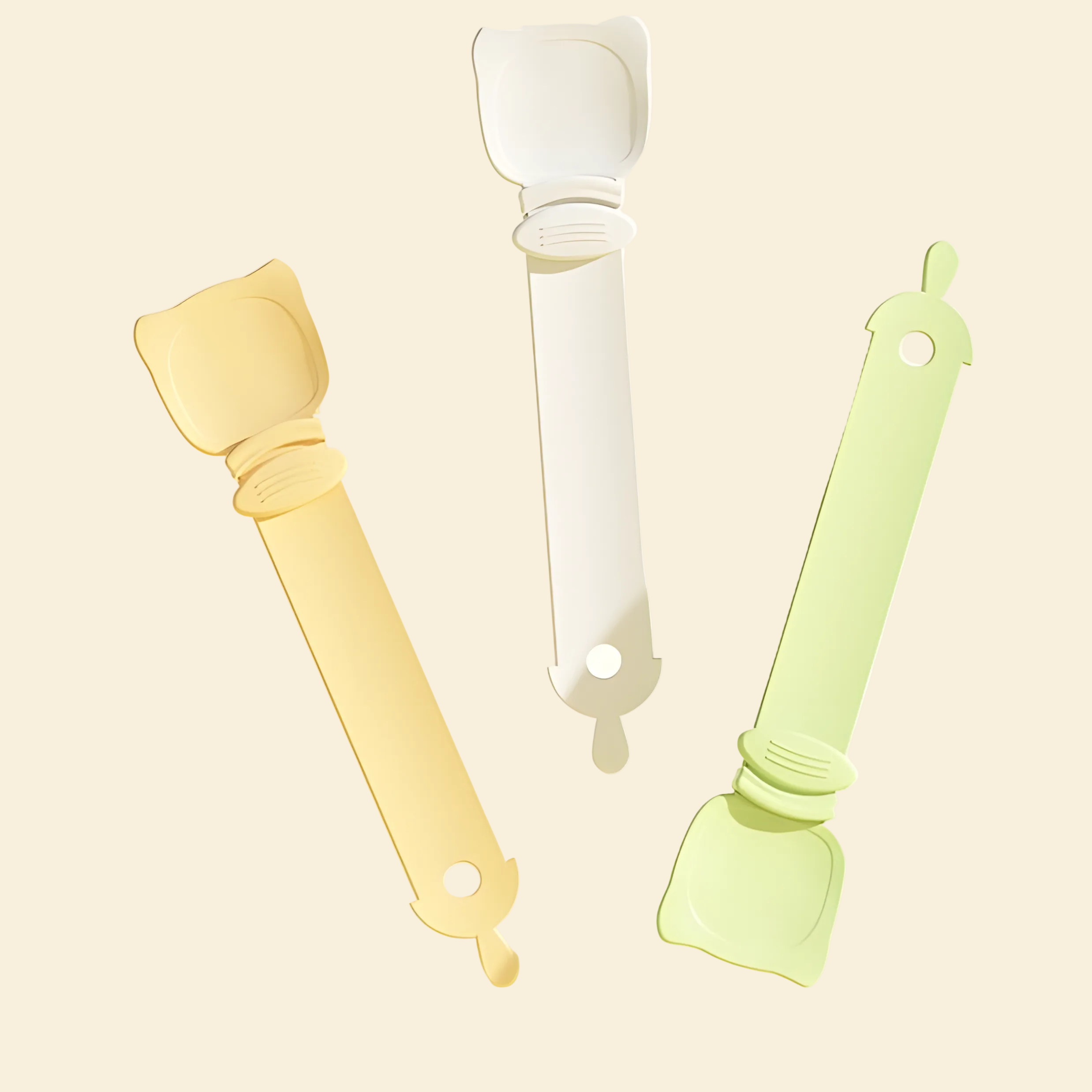 Three cat liquid treat feeding spoons dynamically floating in Soft Green, Cream Beige, and Pastel Orange. Aesthetic and minimalist pet accessories for modern homes.