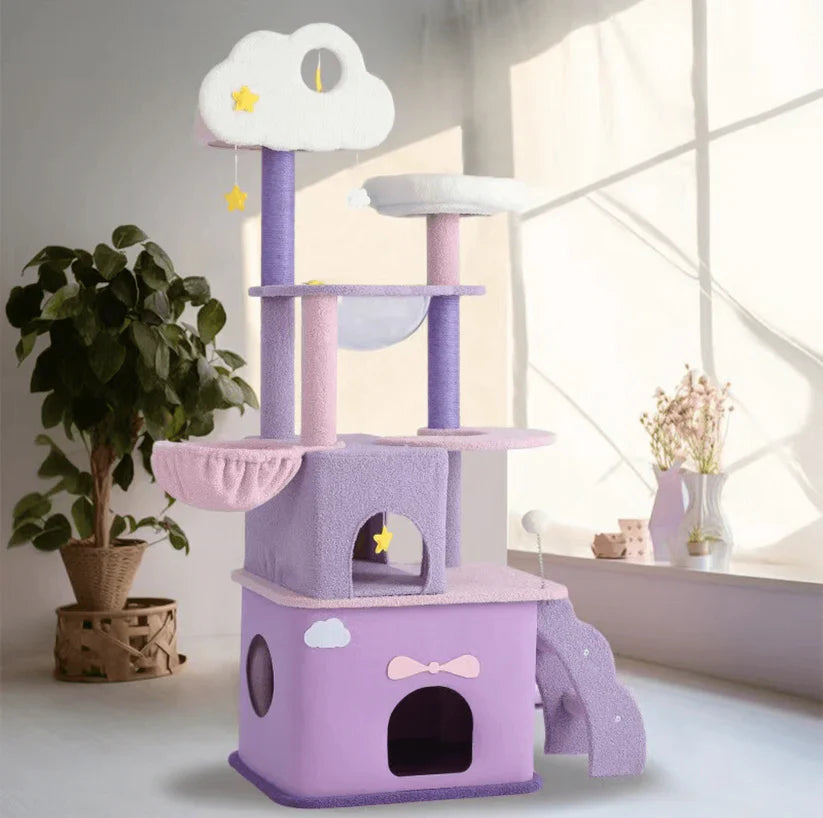 The beautifully designed pastel purple, pink, and white Tales of the Nebula Cat Tree placed in a bright living room, blending feline behavioral needs with artistic home decor.