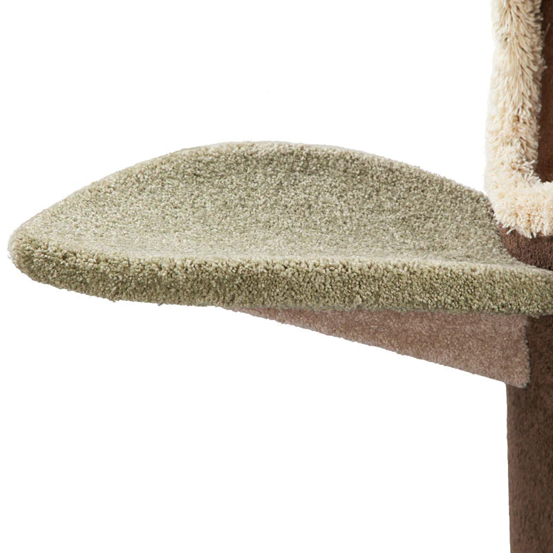 Cat tree with a green cushioned platform on a white background