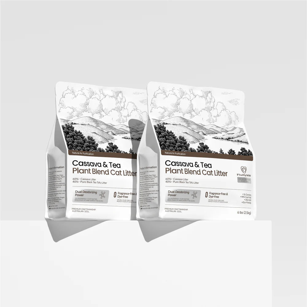 Two 2.5kg bags of FluffyMW Cassava and Tea Plant Blend Cat Litter displayed on a minimalist white pedestal, showcasing the clean, modern packaging design.