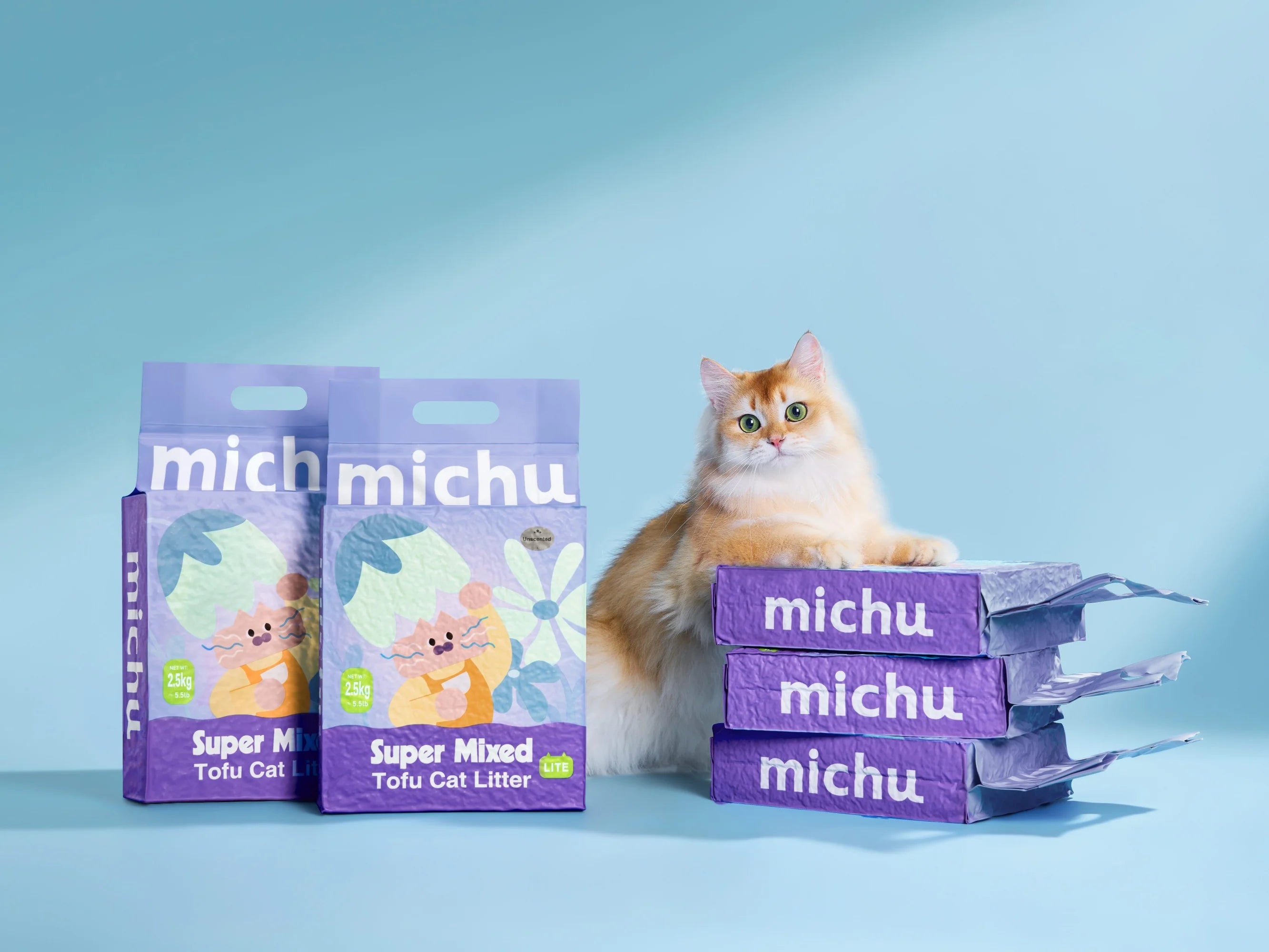 A beautiful golden chinchilla cat resting its paws on a stack of three Michu Super Mixed Tofu Cat Litter Lite bags against a clean blue background, proving it is a cat-approved choice.