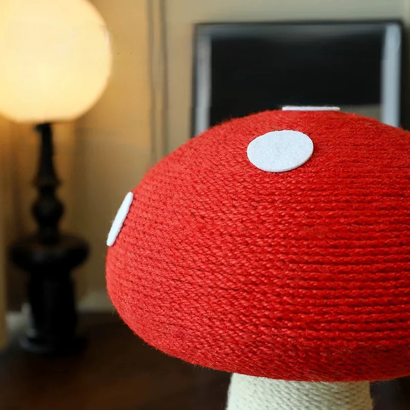Close-up of the vibrant red mushroom cap, showcasing the 100% hand-woven natural sisal rope texture and soft white plush polka dots.