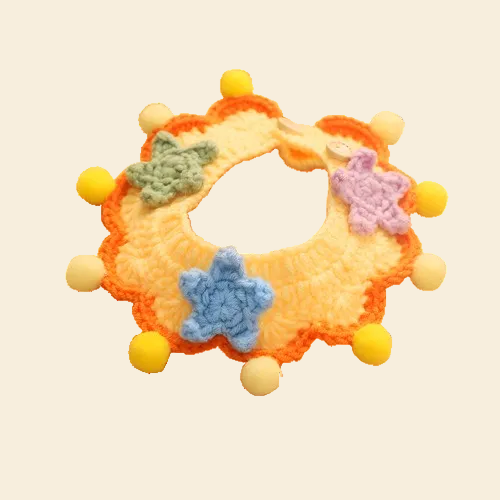 Yellow Knit Bib with Pom-Poms isolated on white background. A weightless, snag-free party accessory perfect for birthdays and Gotcha Days