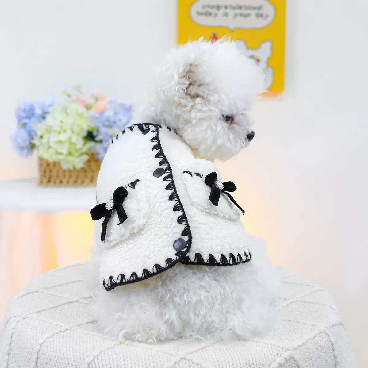 Rear view of a white dog wearing the Little Fragrance Sherpa Vest. Showcases the luxury Parisian style with textured bouclé fleece and elegant black velvet bows."