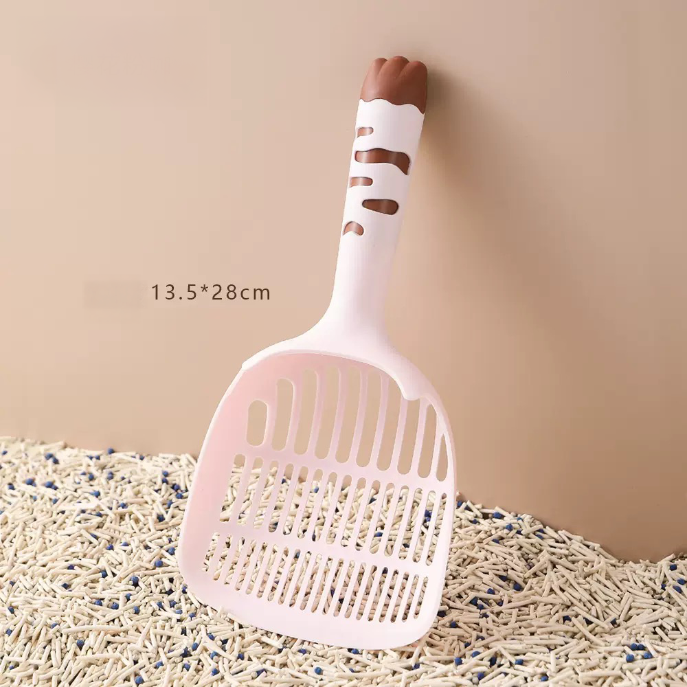 Cream and pink variations of the Precision Scoop. The graduated slots ensure fast filtration, keeping clean sand while removing waste