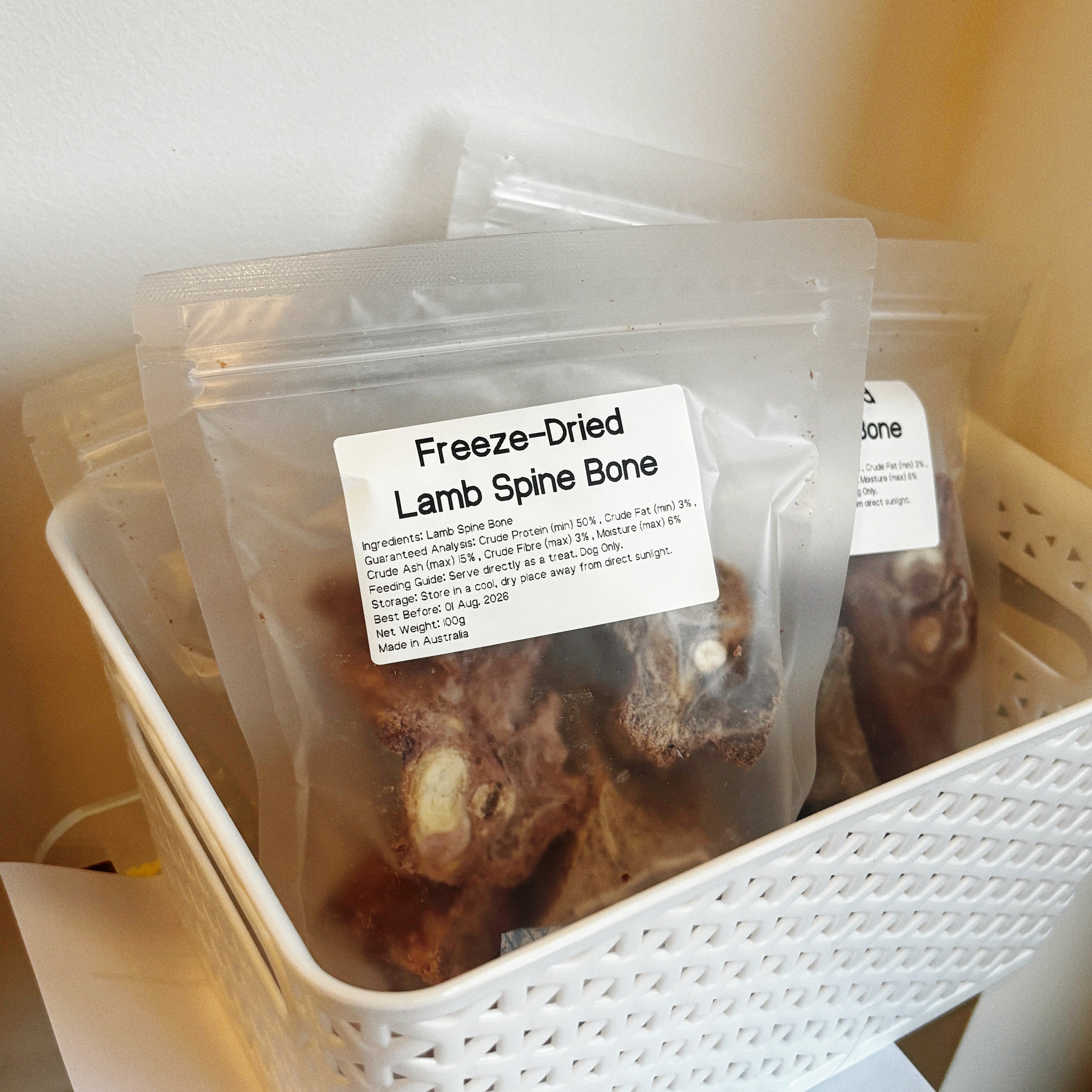 Multiple packs of lamb spine bone chews in a basket, perfect for dog dental cleaning and providing mental enrichment through gnawing.