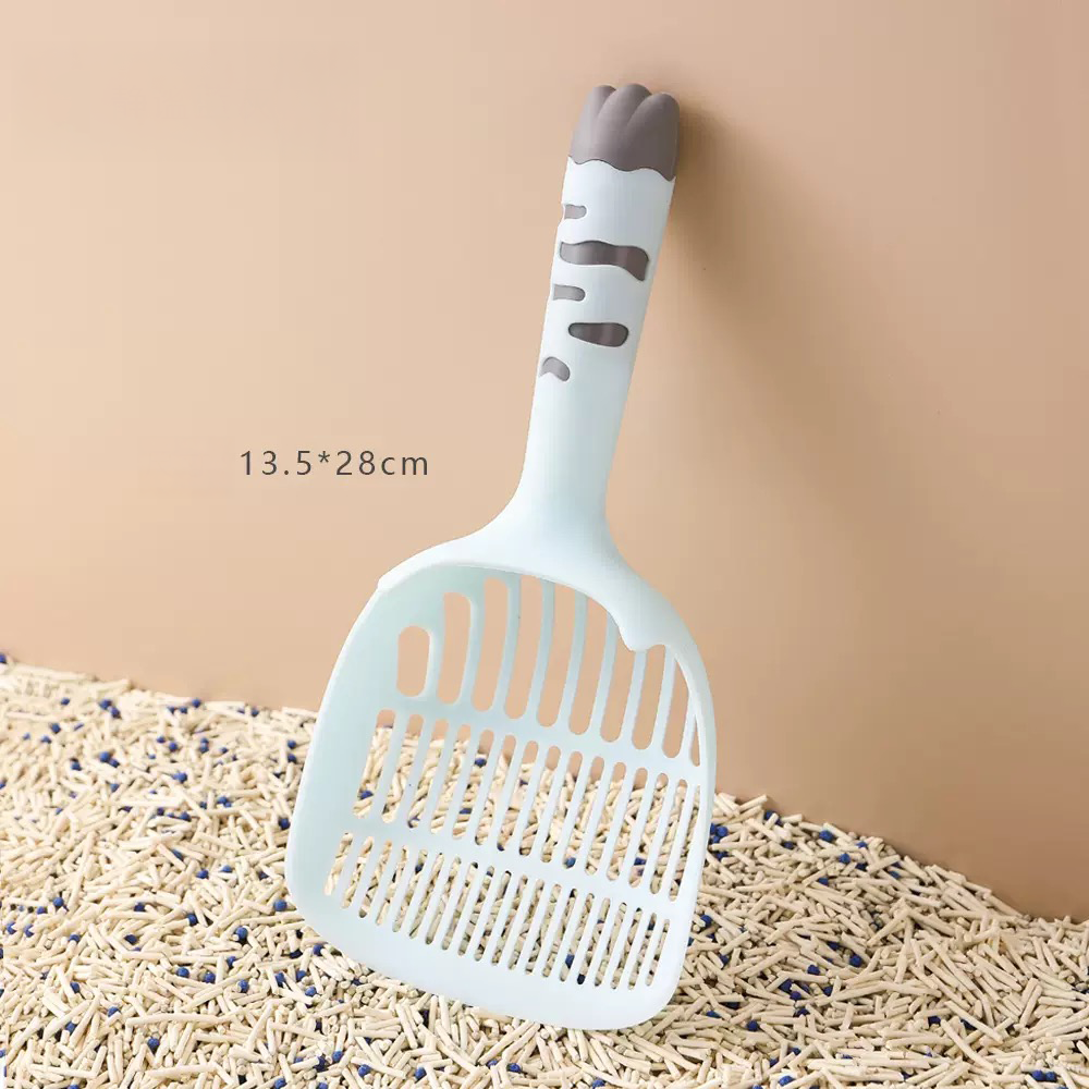Sky blue cat litter scoop standing in mixed litter. Measures 13.5cm x 28cm, perfectly sized for sifting tofu and bentonite clay litter efficiently