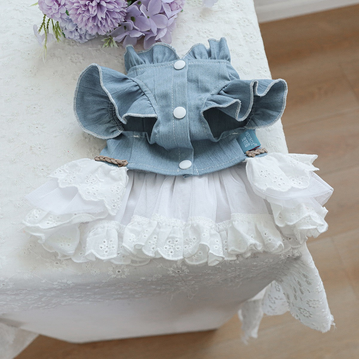 Underside of the western dog dress featuring high-quality white snap buttons for stress-free dressing without wrestling with laces or zippers