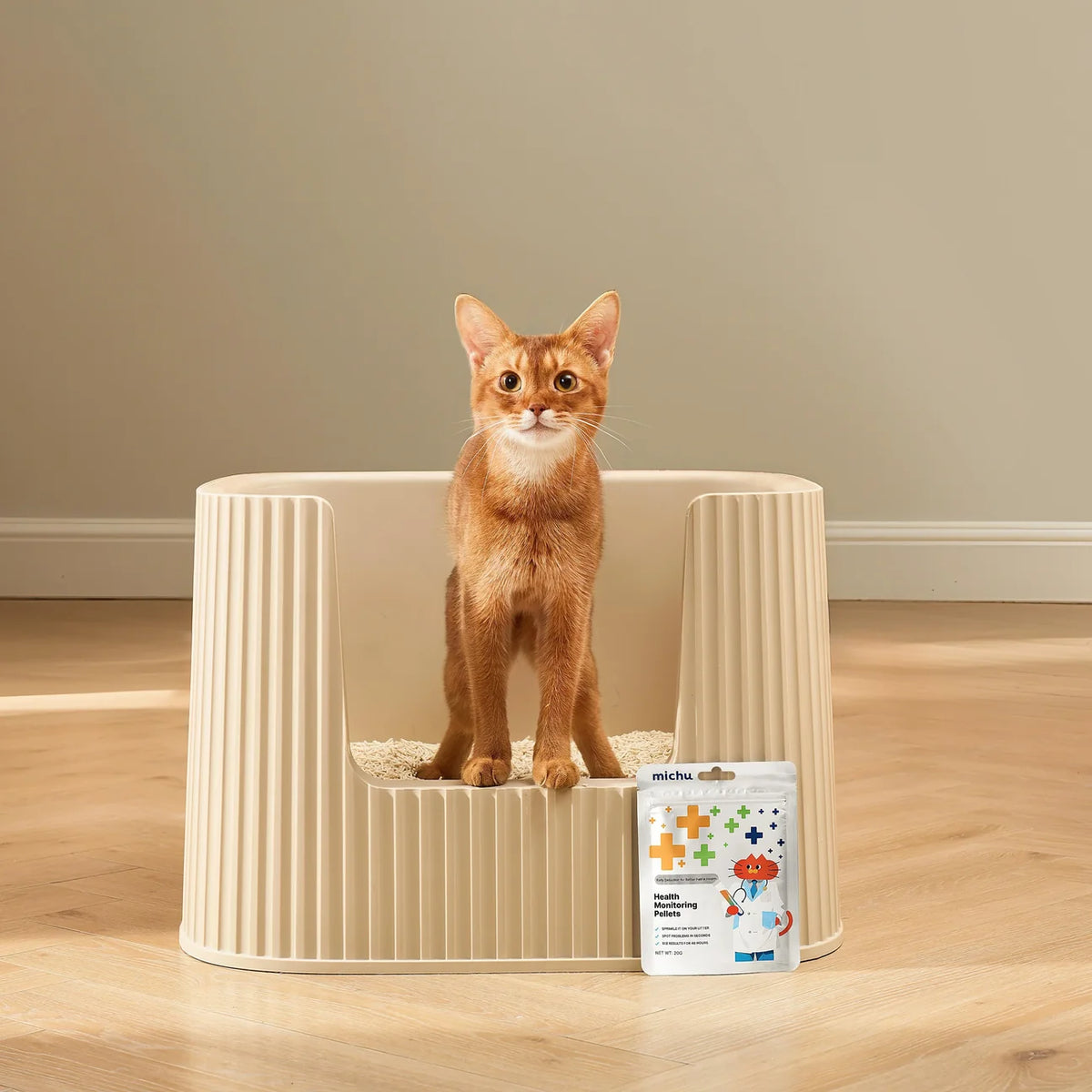 Ginger cat displayed beside MICHU Cat Urine pH Monitoring Pellets, an at-home colour-changing aid for observing urine pH in the litter box