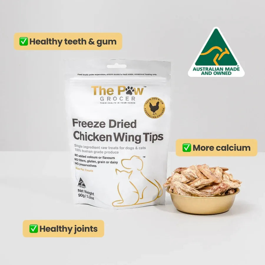 The Paw Grocer Freeze-Dried Chicken Wing Tips 90g bag with a bowl of treats. Highlights healthy teeth and gums, more calcium for strong bones, and healthy joint support. Australian made and owned.