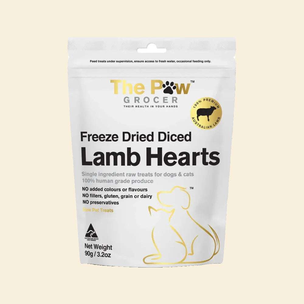 Front view of The Paw Grocer Freeze-Dried Diced Lamb Hearts packaging (90g). 100% human-grade single-ingredient raw treats with no fillers, gluten, grain, or preservatives.