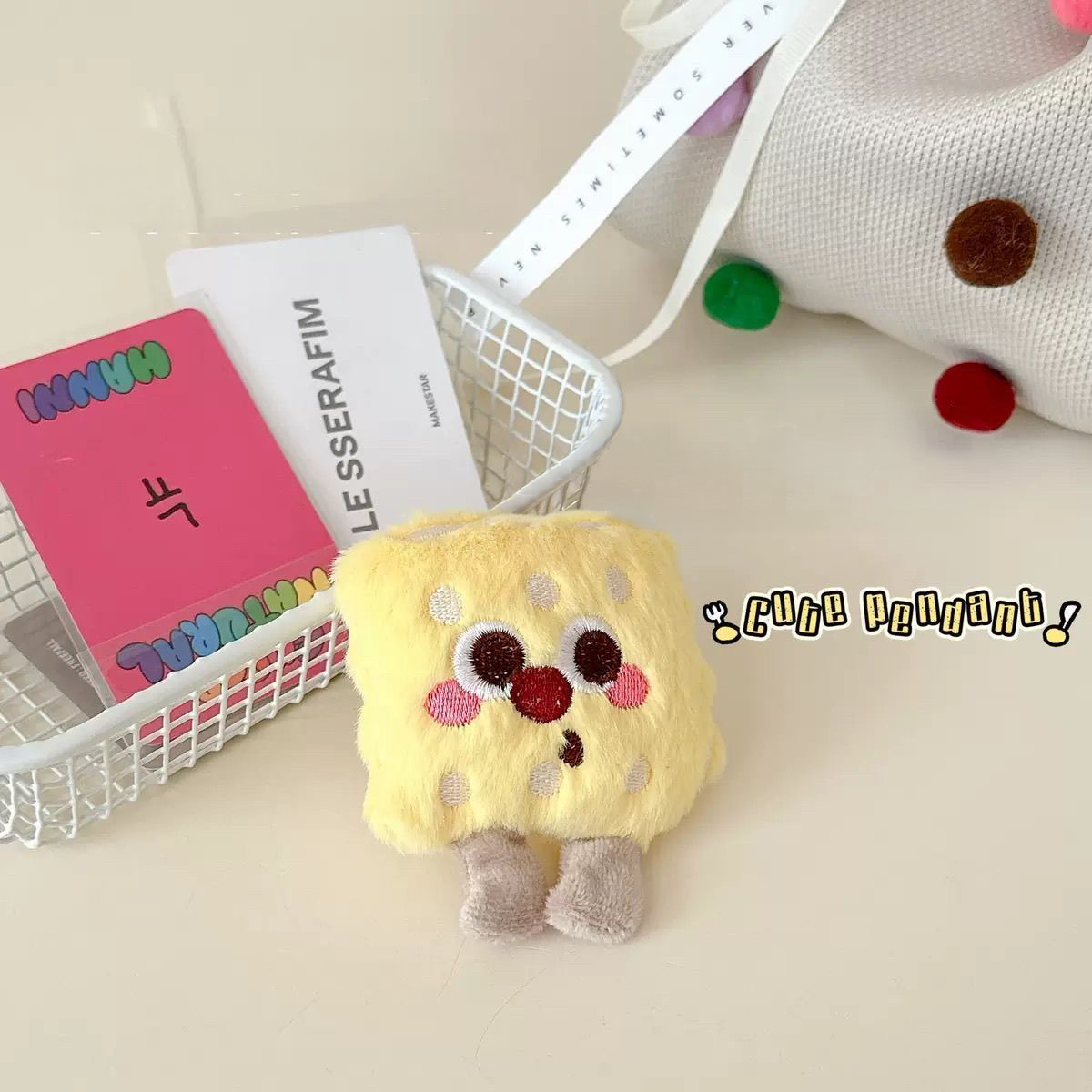 A kawaii yellow cheese cracker plush squeaky toy featuring adorable embroidered details and tiny legs, expertly designed for small pets.