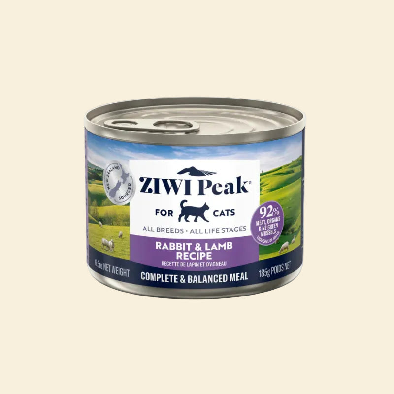 Front of the 185g ZIWI Peak Rabbit and Lamb Recipe can, featuring a lush New Zealand landscape. This protein-rich wet food is suitable for cats of all breeds and life stages.