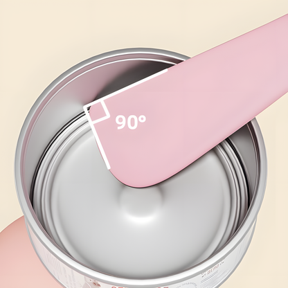 Close-up of a pink silicone spatula using its 90-degree flat edge to perfectly scrape the bottom corner of a cat food tin, ensuring absolutely zero waste.