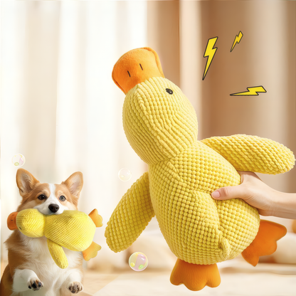 Dog playing with a yellow plush toy, with a person holding another similar toy.