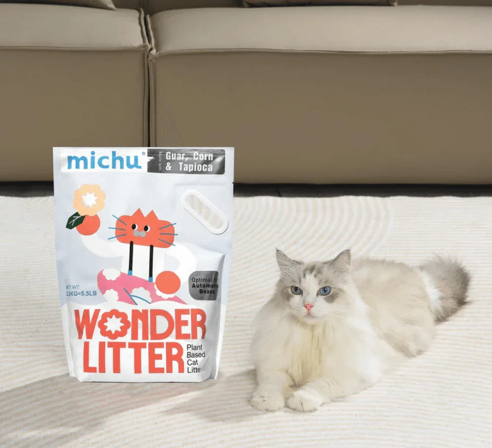 a bag of Michu wonder litter with a cat