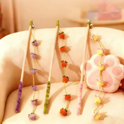 Three variations of the premium wooden cat wand toy: Purple Plum, Orange Tangerine, and Peach Blossom.