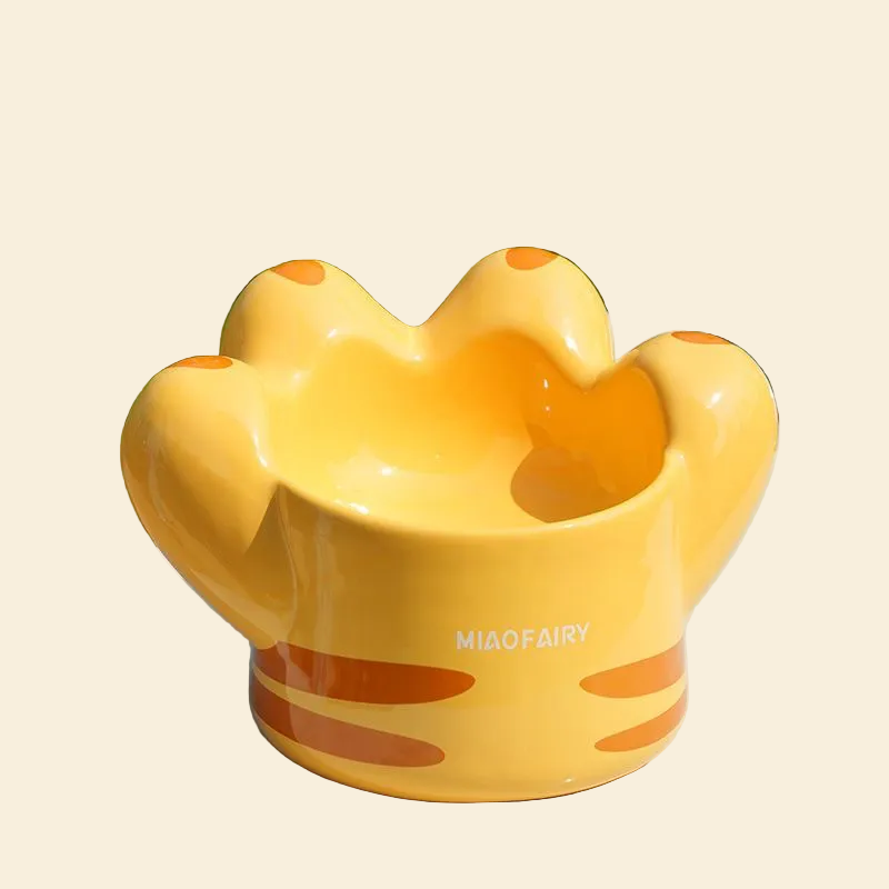 The glossy orange Giant Cat Paw elevated pet bowl , highlighting its beautiful, statement-making design and vibrant color.