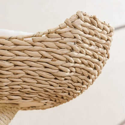 A macro close-up showcasing the meticulous artisanal handwoven texture of the baskets on the Michu Ivy designer cat tree, offering a breathable sanctuary for pets.
