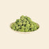 A  view of a small bowl overflowing with vibrant green, bite-sized freeze-dried cat grass chunks, highlighting the crunchy, high-protein texture perfect for training rewards or a meal topper.