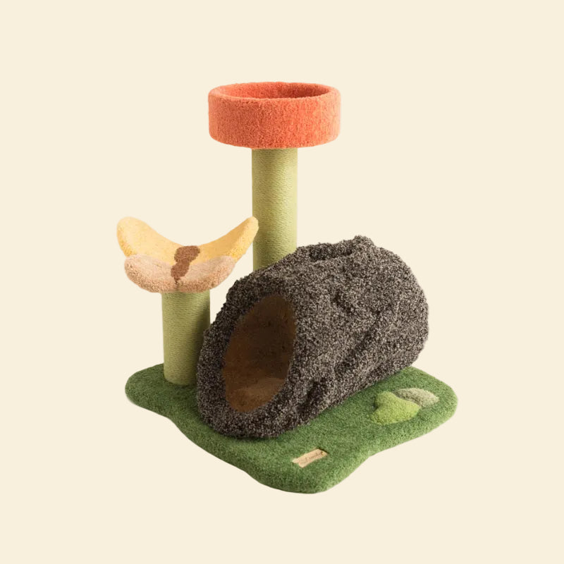 A full view of the Camily Flower Grove Cat Climbing Tree on a pure white background, clearly showing the green lawn base, tree log tunnel, flower bed, and sturdy scratching pillars.