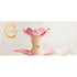 Pink plush flower cat tree with a beige base on a white background, featuring the brand &
