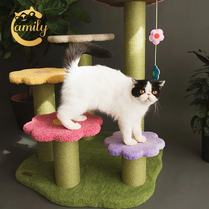 A black and white cat easily stepping across the gradient pink and purple flower platforms of the Camily climbing tree, highlighting the safe and naturally accessible blooming stairway design.