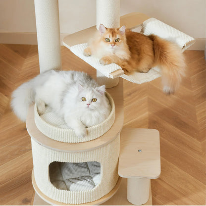 A golden cat lounging in a soft hammock and a white cat resting in a cushioned basket on the Michu Luna modern cat tree. Ideal for napping and multi-cat homes.