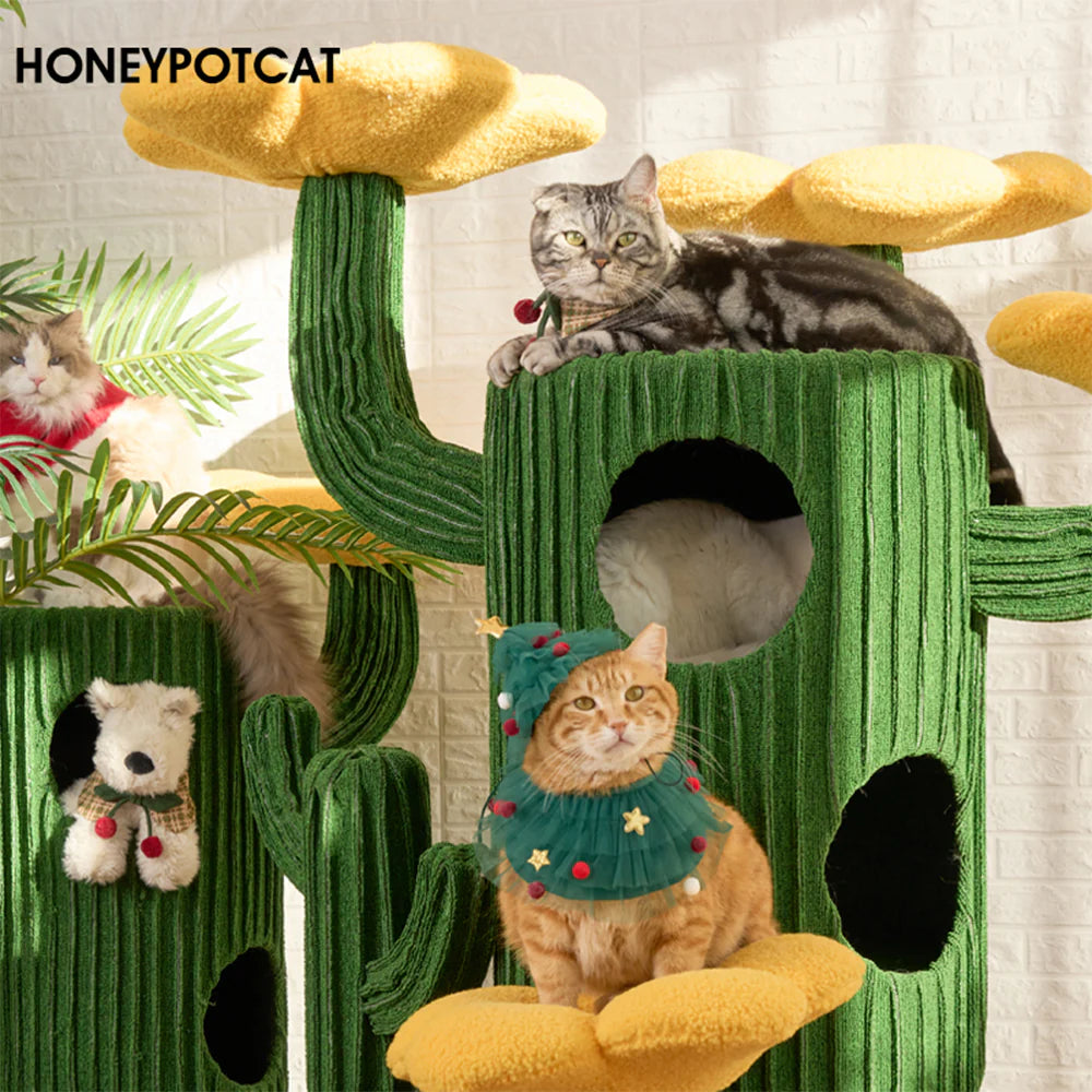 Three cats enjoying the green HONEYPOTCAT Luxe Cactus Bloom cat tree, with one lounging inside the hidden hideaway barrel and others resting on the cozy flower platforms.