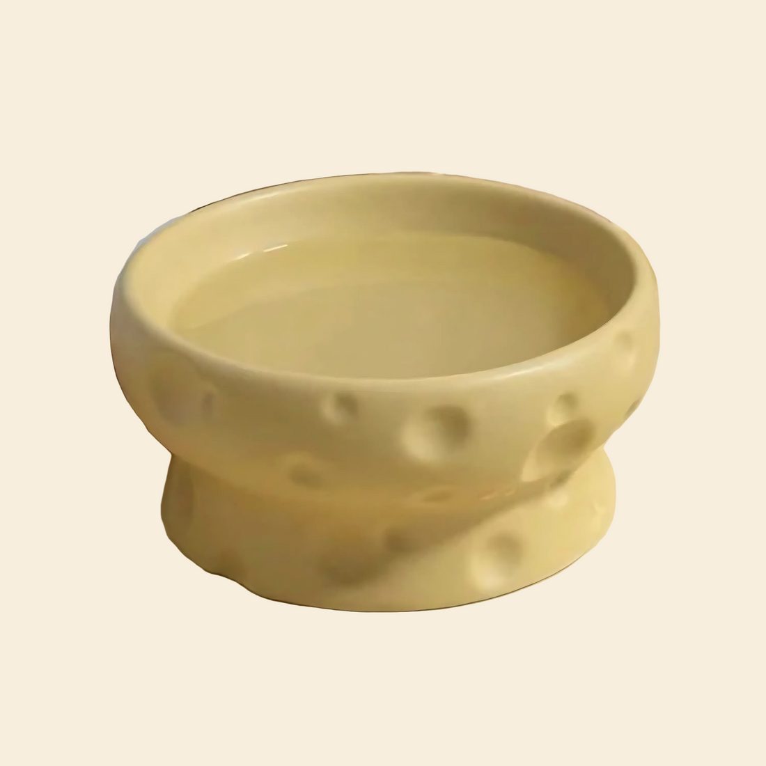 Yellow ceramic bowl with cheese surface