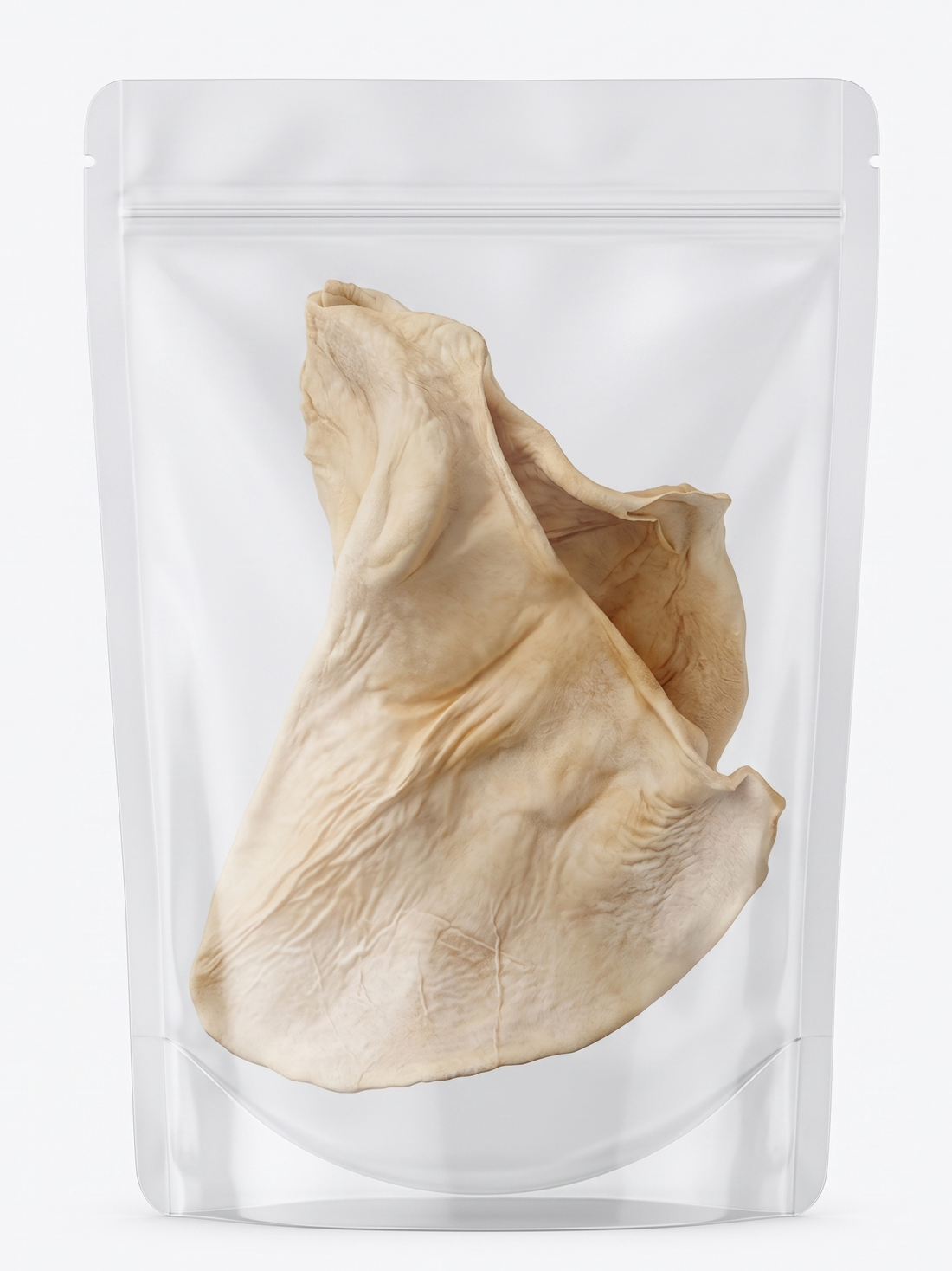 A large, natural freeze-dried beef ear packaged neatly inside a clear, resealable pouch, showcasing this long-lasting, single-ingredient dental chew for dogs.