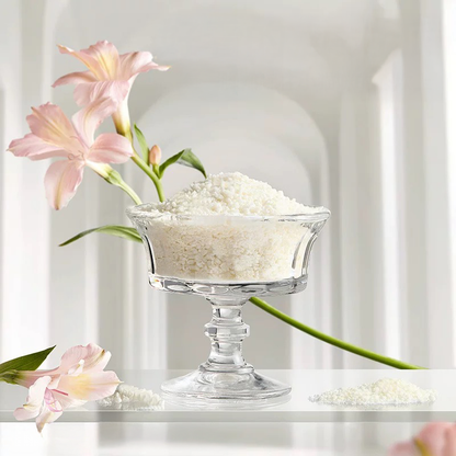 A glass bowl filled with fine, smooth cassava litter granules. The soft texture is designed to be comfortable for delicate kitten paws, fulfilling the promise: &