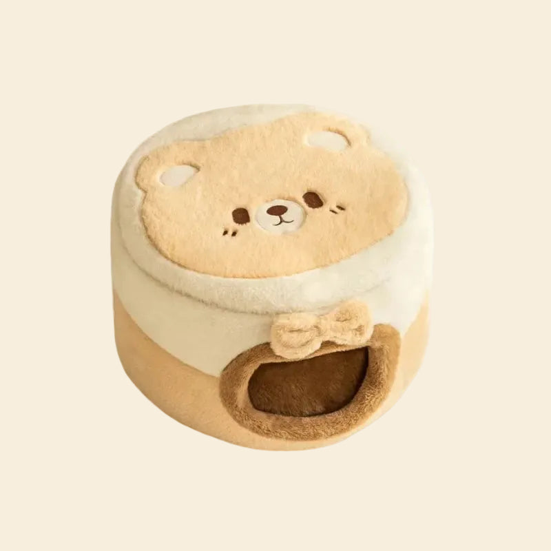 A clean studio shot of the premium 2-in-1 plush cat bed in its enclosed cave style, showcasing the beige animal face design on the roof and the soft faux rabbit fur.