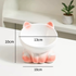 A pink elevated ceramic cat bowl with dimension graphics indicating a 13cm bowl width and a 10cm tall sturdy base.