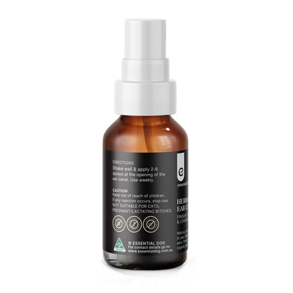 Side view of the Essential Dog ear cleaner bottle, detailing the directions to apply 2-6 sprays weekly, alongside caution notes that it is not suitable for cats or pregnant and lactating dogs.