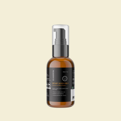 Front view of the 100ml Essential Dog Hemp Seed Oil+ bottle with a black pump, highlighting the Turmeric and Black Pepper formula for dog skin and joint support.