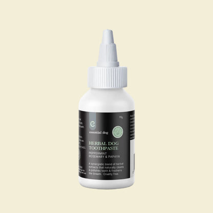 Front view of the 70g Essential Dog Herbal Dog Toothpaste bottle, highlighting the peppermint, rosemary, and papaya synergistic blend for naturally clean and polished teeth.