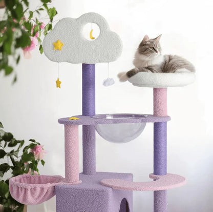 A fluffy cat relaxing on the top plush white resting platform of the 170cm tall cat tower, enjoying the highest vantage point next to a cloud-shaped bed.