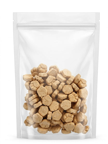 A clean studio view of a clear stand-up pouch filled with premium freeze-dried cat and dog treats, showcasing the adorable paw and hexagon shapes made with a minimum of 65% crude protein.
