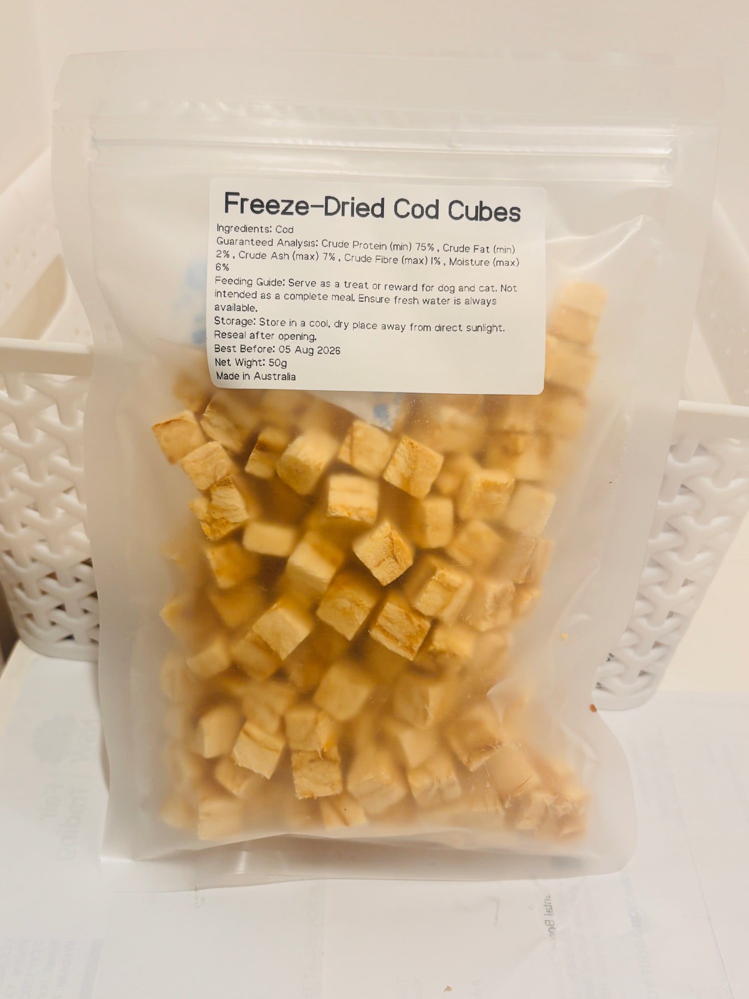 A clear, resealable 50g bag of Freeze-Dried Cod Cubes, featuring a printed label that details the 100 percent cod formula, 75 percent minimum crude protein, and Australian Made quality.