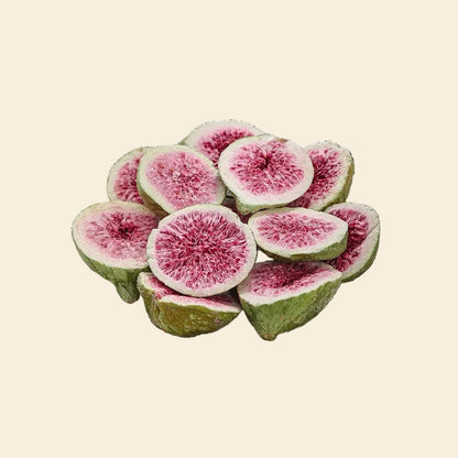 Multiple freeze-dried figs, showing their natural green skin and vibrant pink interior, highlighting the crunchy, single-ingredient healthy dog treat.
