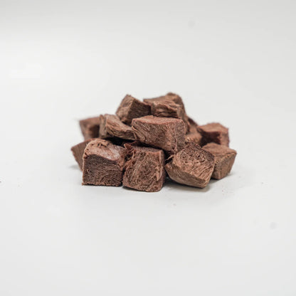 A close-up pile of Rafa Raw freeze-dried kangaroo steak cubes. Dark, rich, single-ingredient raw meat pieces perfect for high-value training rewards and pets with sensitive stomachs.