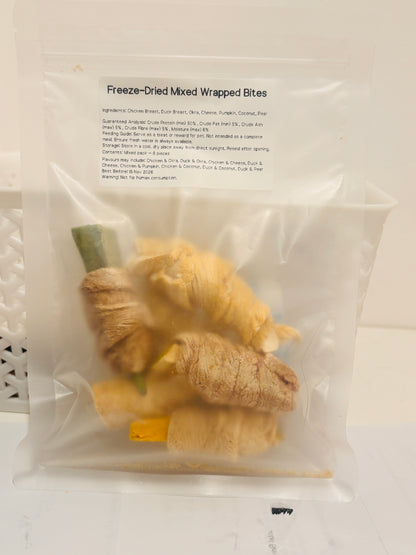 A clear, resealable bag containing a 6-piece mixed pack of Freeze-Dried Wrapped Bites, featuring a printed label that details the meat and superfood ingredients, feeding guide, and a minimum of 50 percent crude protein.