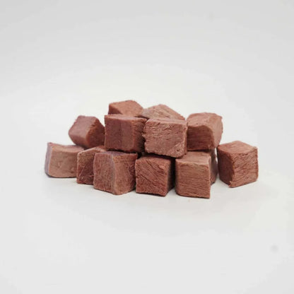 A close-up pile of Rafa Raw freeze-dried wallaby steak cubes. Soft, highly palatable, single-ingredient red meat treats perfect for pets with sensitive stomachs and food allergies.