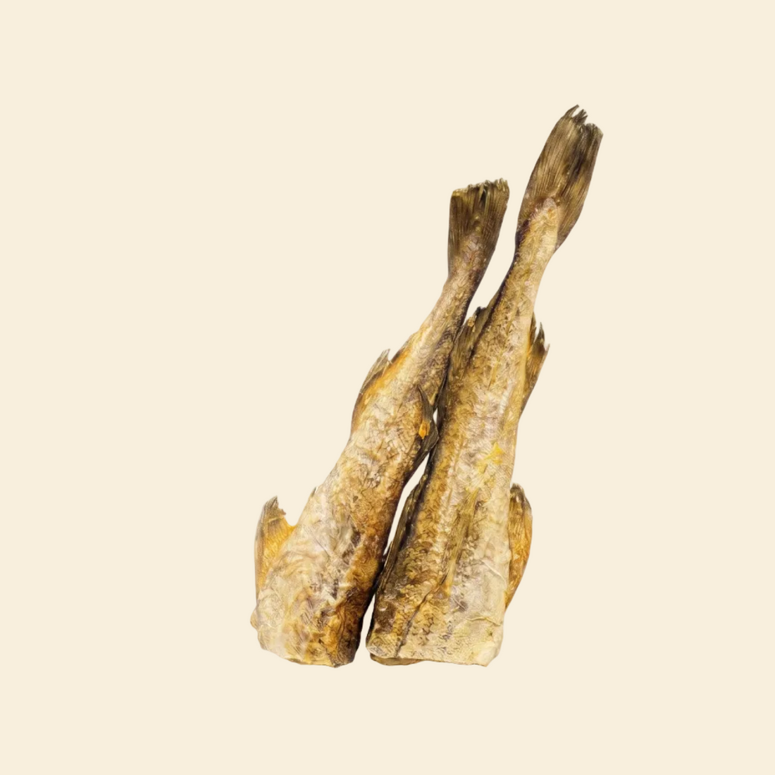 Two whole freeze-dried cod fish standing together on a pure white background, showcasing the natural flaky texture of this lean, hypoallergenic, and high-protein treat for dogs and cats.