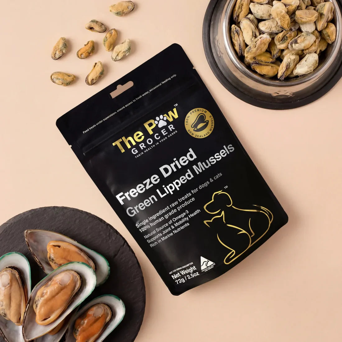 Aesthetic top-down view of green-lipped mussels in shells alongside freeze-dried mussel treats in a bowl. Natural source of glucosamine and chondroitin for pet arthritis relief and hip support.