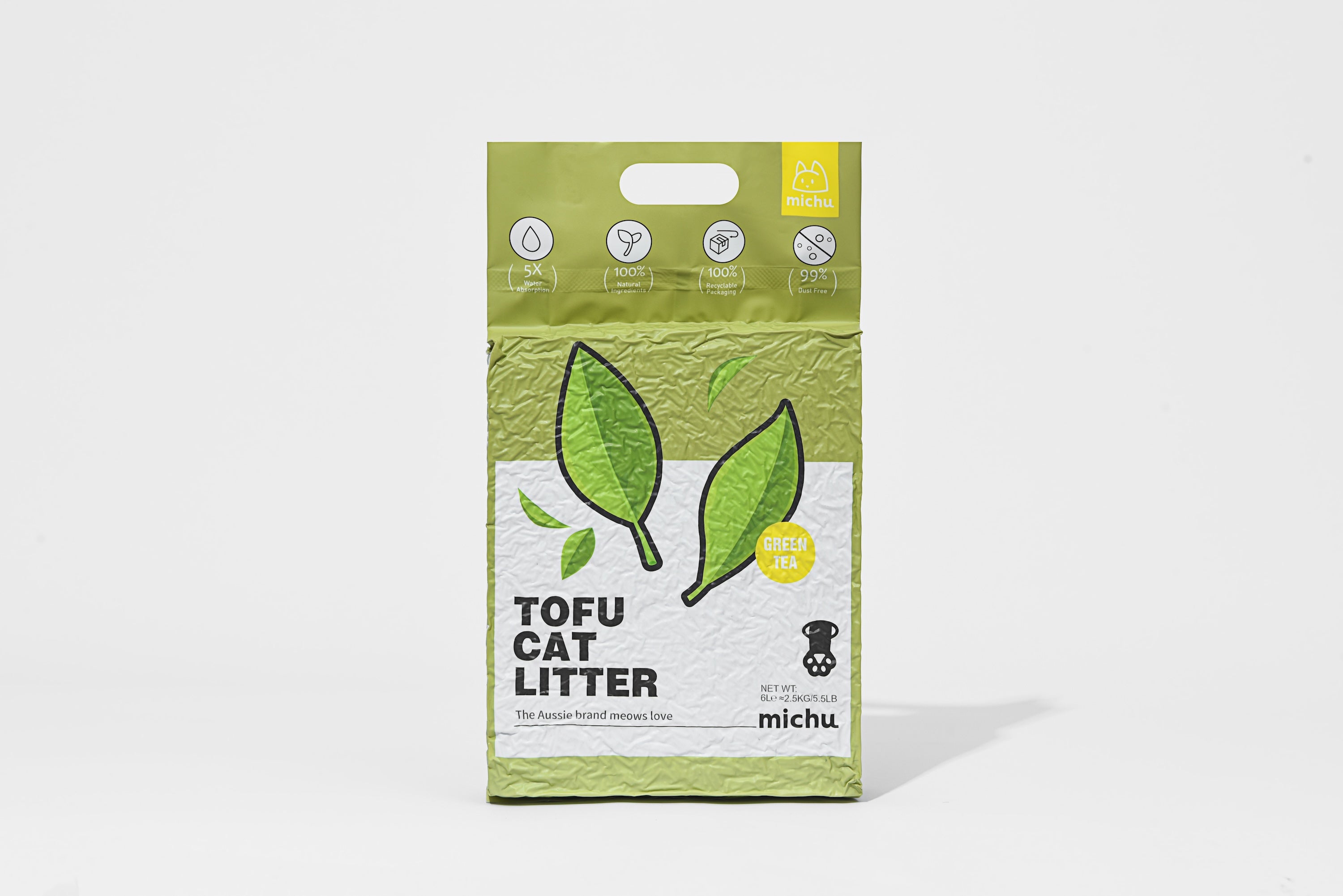 Package of tofu cat litter with green tea leaves on a white background